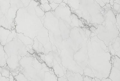The image features a white marble wall with a pattern of white and grey veins. The wall appears to be a part of a building, possibly a bathroom or a kitchen. The marble wall adds a touch of elegance and sophistication to the space.