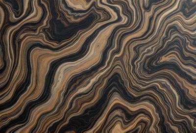 The primary subject of the image is a wooden table with a unique and intricate pattern on its surface. The table appears to be made of wood and has a natural texture. The setting is indoors, with the table being the main focus of the scene. The visual style of the image is a close-up of the wooden table, showcasing its distinctive pattern. The colors and mood of the image are warm and inviting, with the wooden table serving as a beautiful and functional piece of furniture.