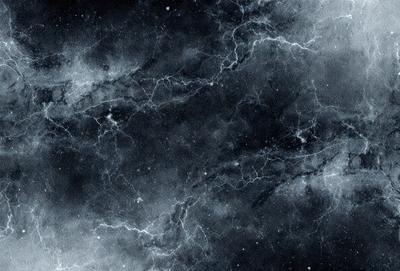 The primary subject of the image is a black and white photo of a galaxy. The setting is a dark, star-filled sky, with the galaxy as the main object. The visual style is a black and white photo, which adds a sense of depth and timelessness to the image. The colors and mood are predominantly dark and moody, with the stars and galaxy creating a sense of vastness and mystery.