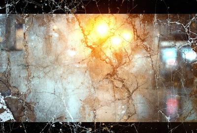 The primary subject of the image is a close-up of a light source, possibly a street light or a light bulb, with a yellowish glow. The setting is a dark room, and the visual style appears to be a combination of a photo and a digital art or illustration. The colors and mood of the image are predominantly dark and moody, with the yellowish glow of the light source creating a contrasting effect.