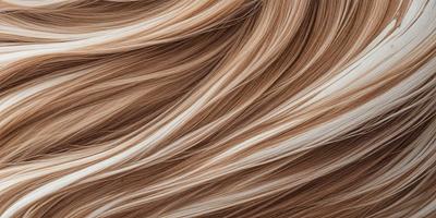 The primary subject of the image is a person's hair, which is blowing in the wind. The setting is outdoors, with the hair blowing in the breeze. The visual style is a close-up of the hair, showcasing its texture and movement. The colors in the image are predominantly brown, giving the hair a natural and warm appearance. The overall atmosphere of the image is one of freedom and movement, as the hair flows in the wind.