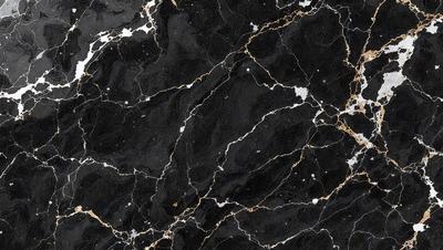 The primary subject of the image is a black and gold marble pattern. The setting is a black and gold marble wall, which serves as the background. The visual style is a close-up of the marble pattern, showcasing the intricate details of the design. The colors and mood of the image are predominantly black and gold, giving it a luxurious and elegant appearance.