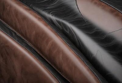The primary subject of the image is a close-up of a brown leather item, possibly a leather jacket or a leather bag. The setting is a dark room, and the visual style appears to be a close-up of the leather item. The colors and mood of the image are dark and moody, with the brown leather item being the main focus.