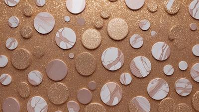 The primary subject of the image is a collection of marble circles, which are arranged on a gold background. The setting is a patterned surface, possibly a wall or a table, with the circles placed on top of it. The visual style of the image is a combination of photo and digital art, creating a unique and eye-catching design. The colors and mood of the image are warm and inviting, with the gold background and marble circles creating a sense of luxury and elegance.
