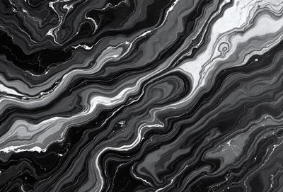 The primary subject of the image is a black and white marble pattern. The setting is a black and white marble surface, which serves as the background. The visual style is a close-up of the marble pattern, showcasing its intricate details. The colors and mood of the image are predominantly black and white, giving it a classic and elegant appearance.