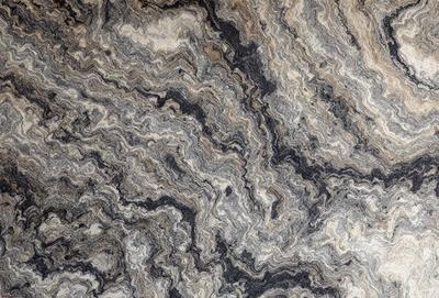 The primary subject of the image is a close-up of a marble surface with a unique and intricate pattern. The setting is a stone countertop, and the visual style is a photo. The colors and mood of the image are predominantly dark and moody, with the marble surface providing a striking contrast against the background.