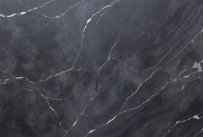 The primary subject of the image is a close-up of a marble tile wall. The setting is a room with a gray marble tile wall, which serves as the background. The visual style is a photo, capturing the details of the marble tile wall. The colors and mood of the image are predominantly gray, giving it a sophisticated and elegant appearance.