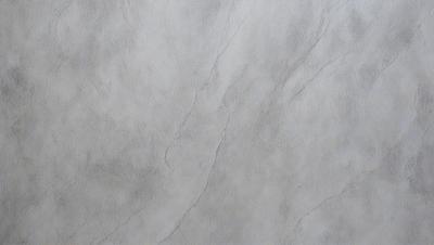 The primary subject of the image is a white marble wall with a textured surface. The setting is a room with a white marble wall as the main focus. The visual style is a close-up of the marble wall, showcasing its texture and details. The colors and mood of the image are predominantly white, giving it a clean and elegant appearance.