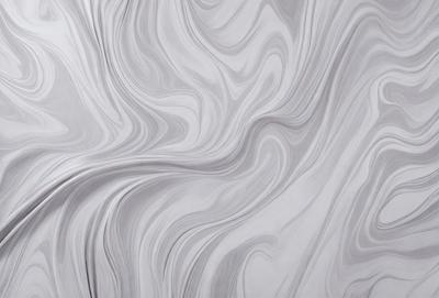 The primary subject of the image is a large, white, and gray marble wall. The setting is a room with a white and gray marble floor. The visual style is a close-up of the marble wall, showcasing its intricate patterns and textures. The colors and mood of the image are predominantly white and gray, giving it a clean and elegant appearance.