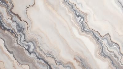 The image features a marble-like surface with a pattern of swirls and waves. The primary subject is the marble-like surface, which is the setting and background of the image. The visual style is a close-up of the marble, showcasing its intricate patterns. The colors and mood of the image are predominantly white, giving it a clean and elegant appearance.
