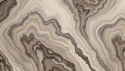 The primary subject of the image is a close-up of a textured surface, possibly a piece of fabric or a wallpaper design. The setting appears to be a room with a wooden floor. The visual style of the image is a combination of a photo and a digital art, as it captures the intricate details of the textured surface. The colors and mood of the image are predominantly brown and gray, giving it a warm and earthy atmosphere.