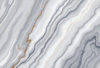 The primary subject of the image is a marble countertop with a unique, swirled pattern. The setting is a kitchen or bathroom, as the countertop is a prominent feature in the scene. The visual style is a close-up of the marble countertop, showcasing its intricate design. The colors and mood of the image are predominantly neutral, with the marble countertop being the main focus and source of visual interest.