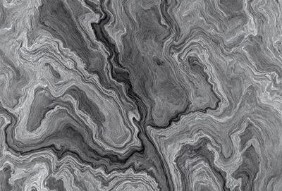 The primary subject of the image is a close-up of a gray, textured stone surface. The setting is a dark room, and the visual style appears to be a combination of a photo and a digital art or illustration. The dominant colors are gray and black, creating a moody atmosphere.