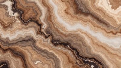 The primary subject of the image is a close-up of a marble stone with a unique, swirling pattern. The setting is a natural environment, with the stone being the main focus of the scene. The visual style is a close-up of the marble, showcasing its intricate texture and pattern. The colors in the image are predominantly earthy tones, such as brown and beige, which contribute to a natural and organic atmosphere.