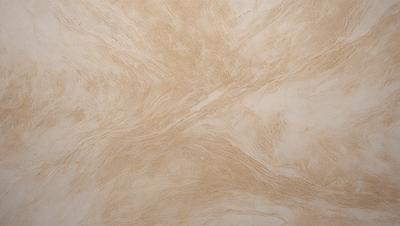 The image features a large, tan-colored marble tile with a swirling pattern. The tile appears to be made of marble, giving it a luxurious and elegant appearance. The pattern on the tile adds visual interest and depth to the surface, making it an attractive and unique design element.