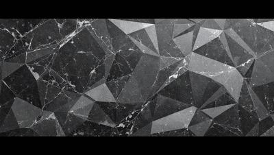 The image features a black and white marble pattern on a wall. The marble pattern is intricate and creates a visually striking design. The overall atmosphere of the image is elegant and sophisticated, with the marble pattern serving as the primary subject.