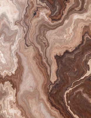 The primary subject of the image is a close-up of a marble-like stone with a unique and intricate pattern. The setting is a natural environment, possibly a rock formation or a stone wall. The visual style is a close-up of the stone, showcasing its texture and details. The colors and mood of the image are earthy and natural, with a sense of depth and complexity in the stone's pattern.
