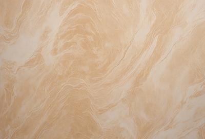 The primary subject of the image is a marble wall with a unique, swirling pattern. The setting is a room with a tan color scheme. The visual style is a close-up of the marble wall, showcasing its intricate design. The colors and mood of the image are warm and inviting, with the tan marble creating a sense of elegance and sophistication.