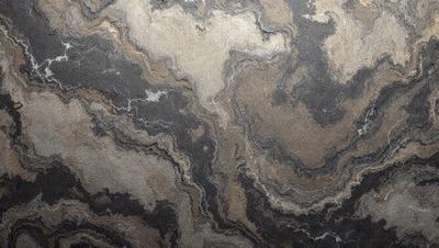 The primary subject of the image is a close-up of a marble countertop. The setting is a kitchen, with the countertop being the main focus of the scene. The visual style is a photo, capturing the intricate details of the marble surface. The colors and mood of the image are predominantly dark, with the marble countertop being the main source of light and contrast.