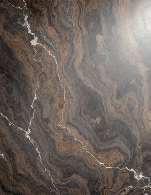 The primary subject of the image is a marble countertop with a unique, swirling pattern. The setting is a kitchen or bathroom, as the countertop is a part of the room's design. The visual style is a close-up of the marble countertop, showcasing its intricate pattern. The colors and mood of the image are predominantly brown and earthy, giving the space a warm and natural ambiance.