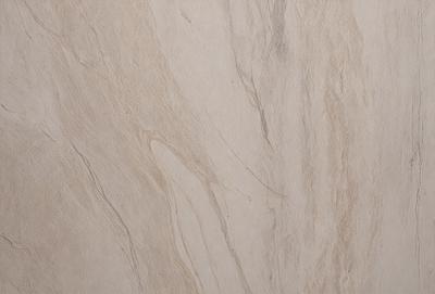 The primary subject of the image is a marble wall with a patterned texture. The setting is a room with a white background. The visual style is a close-up of the marble wall, showcasing its intricate design. The colors and mood of the image are predominantly neutral, with the marble wall providing a sense of elegance and sophistication.
