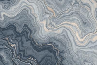 The primary subject of the image is a close-up of a blue and grey marbled stone. The setting is a stone surface, and the visual style appears to be a photo. The dominant colors in the image are blue and grey, creating a calm and serene atmosphere.