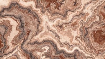 The primary subject of the image is a close-up of a marble-like pattern, which appears to be a wood grain texture. The setting is a wooden surface, and the visual style is a close-up of the pattern. The colors and mood of the image are predominantly brown and earthy tones, giving it a natural and warm atmosphere.