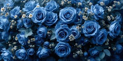 The primary subject of the image is a bouquet of blue flowers. The setting is a garden, with the flowers placed on a bed of green leaves. The visual style is a close-up of the flowers, showcasing their vibrant blue color. The overall atmosphere is serene and peaceful, with the blue flowers creating a calming and soothing effect.