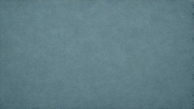 The primary subject of the image is a blue carpet. The setting is a blue background, which creates a visually appealing contrast with the carpet. The visual style is a close-up of the carpet, showcasing its texture and pattern. The colors and mood of the image are predominantly blue, giving it a calm and serene atmosphere.