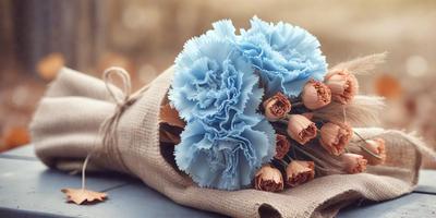 The primary subject of the image is a bouquet of flowers, which are blue and pink in color. The flowers are arranged in a brown paper bag, giving the scene a rustic and natural feel. The setting appears to be outdoors, with a table visible in the background. The visual style of the image is a close-up of the flowers, emphasizing their beauty and details. The dominant colors of the flowers and the paper bag create a calming and serene atmosphere.