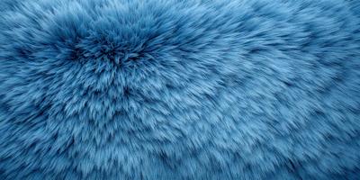 The primary subject of the image is a blue, furry, and fluffy object, which appears to be a large, round, and fuzzy pillow. The setting is a blue background, which complements the blue fur of the object. The visual style is a close-up of the blue furry object, showcasing its texture and details. The colors and mood of the image are predominantly blue, creating a calm and soothing atmosphere.