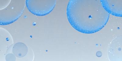 The primary subject of the image is a blue bubble floating in a white background. The visual style appears to be a photo, as the bubble is captured in a close-up shot. The colors and mood of the image are predominantly blue and white, creating a serene and calming atmosphere.