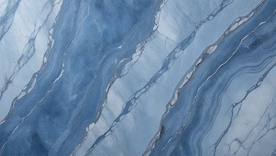 The primary subject of the image is a blue and white marble tile. The setting is a wall with a blue and white marble tile pattern. The visual style is a close-up of the marble tile, showcasing its intricate design. The colors and mood of the image are predominantly blue and white, creating a clean and elegant atmosphere.