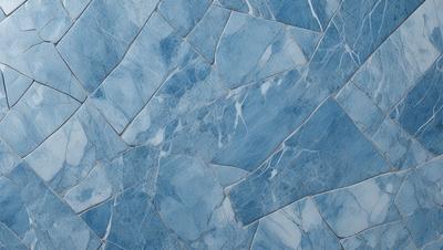 The primary subject of the image is a blue marble wall with a pattern of white and blue diamond shapes. The setting is a room with a blue marble floor, and the visual style is a close-up of the marble wall. The colors and mood of the image are predominantly blue, creating a calm and serene atmosphere.
