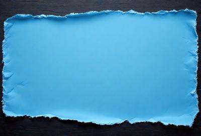 The primary subject of the image is a blue sheet of paper or fabric, which is the main object in the scene. The setting is a wooden table, and the visual style is a close-up of the blue material. The colors and mood of the image are predominantly blue, creating a calm and serene atmosphere.