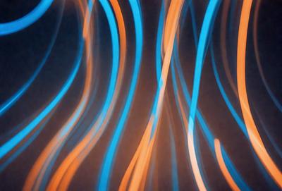The primary subject of the image is a blue and orange striped pattern. The setting is a dark background, which contrasts with the bright colors of the pattern. The visual style appears to be a digital art or illustration, as the colors and patterns are well-defined and the overall atmosphere is vibrant and lively.