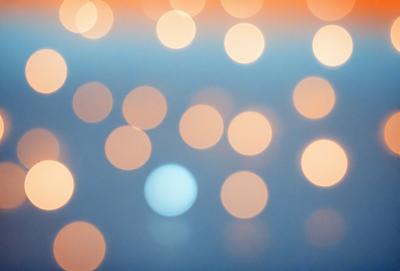 The primary subject of the image is a large number of bright, white lights, which are scattered throughout the scene. The lights are positioned in various shapes and sizes, creating a visually appealing and dynamic composition. The setting appears to be a dark background, which contrasts with the bright lights, emphasizing their presence. The visual style of the image is a combination of photo and digital art, as the lights are captured in a way that resembles a painting or drawing. The colors and mood of the image are predominantly
