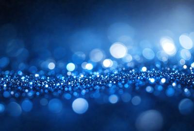 The primary subject of the image is a blue background with a pattern of bright, white, and blue lights. The setting appears to be a dark room, and the visual style is a combination of a photo and digital art. The colors and mood of the image are predominantly blue, with the white and blue lights creating a sense of depth and contrast.