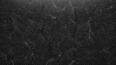 The primary subject of the image is a marble countertop with a black and white pattern. The setting is a kitchen, and the visual style is a close-up of the marble countertop. The colors and mood of the image are predominantly black and white, giving it a classic and elegant appearance.