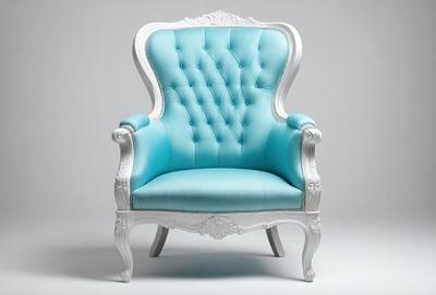 The primary subject of the image is a blue chair with white accents. The chair is positioned on a white surface, which serves as the background. The visual style of the image is a photo, capturing the details of the chair and its surroundings. The colors and mood of the image are predominantly blue and white, creating a clean and elegant atmosphere.