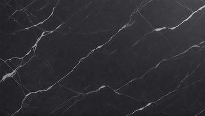 The primary subject of the image is a black marble countertop. The setting is a kitchen, with the countertop being the main focus of the scene. The visual style is a close-up of the marble countertop, showcasing its texture and pattern. The colors and mood of the image are predominantly dark, with the black marble providing a striking contrast against the surrounding environment.