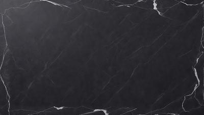 The primary subject of the image is a black marble countertop. The setting is a kitchen, with the countertop being the main focus of the scene. The visual style is a photo, capturing the countertop's texture and appearance. The colors and mood of the image are predominantly dark, with the black marble countertop being the main source of contrast.