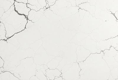 The image features a white marble wall with a rough texture, giving it a natural and elegant appearance. The wall is covered in a pattern of white and grey, creating a visually appealing contrast. The overall atmosphere of the image is serene and sophisticated, making it an attractive and stylish backdrop for various settings.