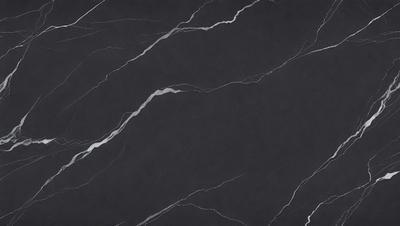 The primary subject of the image is a black marble countertop. The setting is a kitchen, with the countertop being the main focus of the scene. The visual style is a close-up of the marble countertop, showcasing its texture and details. The colors and mood of the image are predominantly dark, with the black marble countertop being the main source of contrast and visual interest.