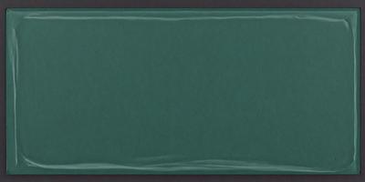 The primary subject of the image is a green background. The setting is a dark room, and the visual style is a photo. The colors and mood of the image are predominantly dark and moody, with the green background being the main focus.