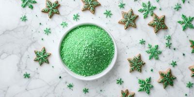 The primary subject of the image is a bowl filled with green, round, and white cookies. The cookies are arranged in a visually appealing manner, creating a sense of abundance and festivity. The setting is a dining table, and the visual style is a close-up of the bowl of cookies. The colors and mood of the image are predominantly green and white, giving it a fresh and clean appearance.