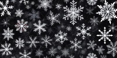The primary subject of the image is a pattern of white snowflakes. The setting is a black background, which contrasts with the white snowflakes. The visual style is a combination of a photo and digital art, as the snowflakes are arranged in a visually appealing manner. The colors and mood of the image are predominantly white, giving it a clean and serene atmosphere.