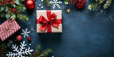The primary subject of the image is a red bow on a present. The setting is a blue background with snowflakes and pine trees. The visual style is a photo, and the colors and mood are festive and joyful.