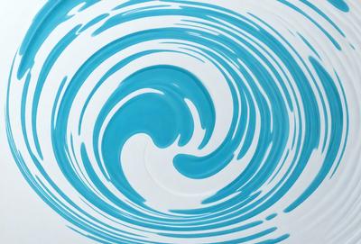 The primary subject of the image is a blue and white ocean wave. The wave is depicted in a swirling pattern, giving it a dynamic and flowing appearance. The setting is the ocean, with the wave crashing against the surface. The visual style of the image is a combination of photo and digital art, creating a realistic yet artistic representation of the ocean wave. The dominant colors in the image are blue and white, which evoke a sense of calmness and tranquility.