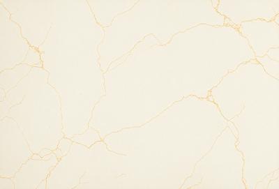 The primary subject of the image is a white marble wall with a yellowish tint. The setting is a room with a white marble floor. The visual style is a close-up of the marble wall, showcasing its texture and color. The colors and mood of the image are predominantly white and yellow, giving it a warm and natural ambiance.